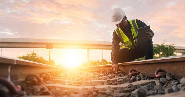 Construction worker reviewing digital project information